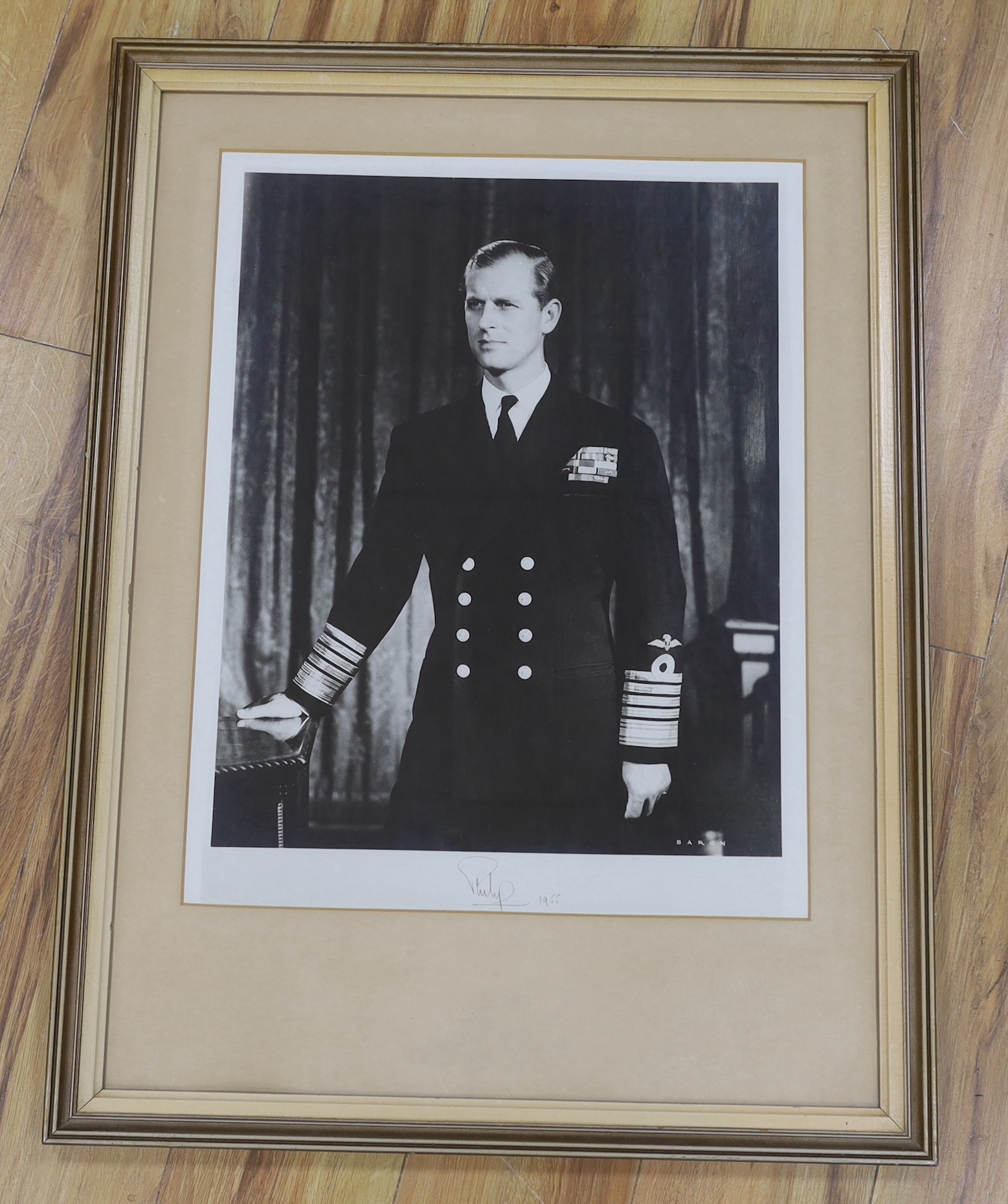 A signed black and white portrait photograph, Prince Philip, by Baron, dated 1955, 43cm wide x 56cm high